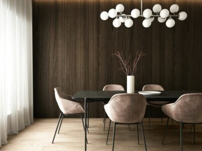 a room with a table chairs and a plant with lights